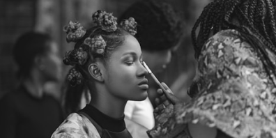 Woman getting makeup applied