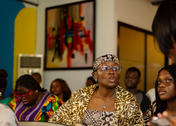 Woman in African print clothing at conference