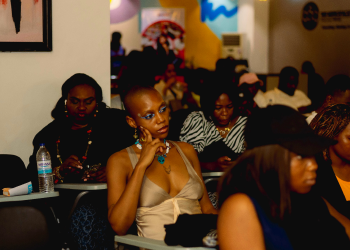 Woman in audience listening attentively